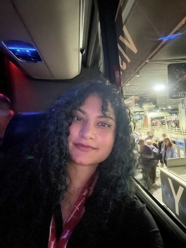 Woman on a shuttle bus on her way to the SpaceX Crew 7 launch area at Kennedy Space Center