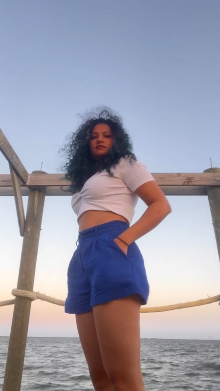 Woman on the Space coast across from NASA on the dock enjoying a beautiful sunset