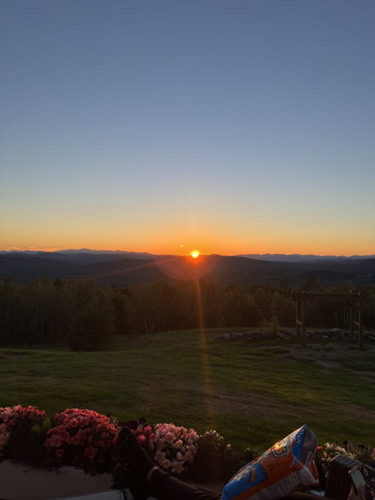 sunset from mountain porch burning yellow to deep blue solo trip Maine