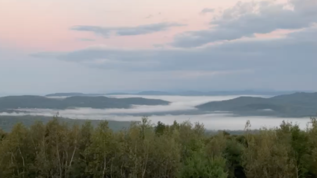 foggy mountain sunrise Maine after a wild night solo travel