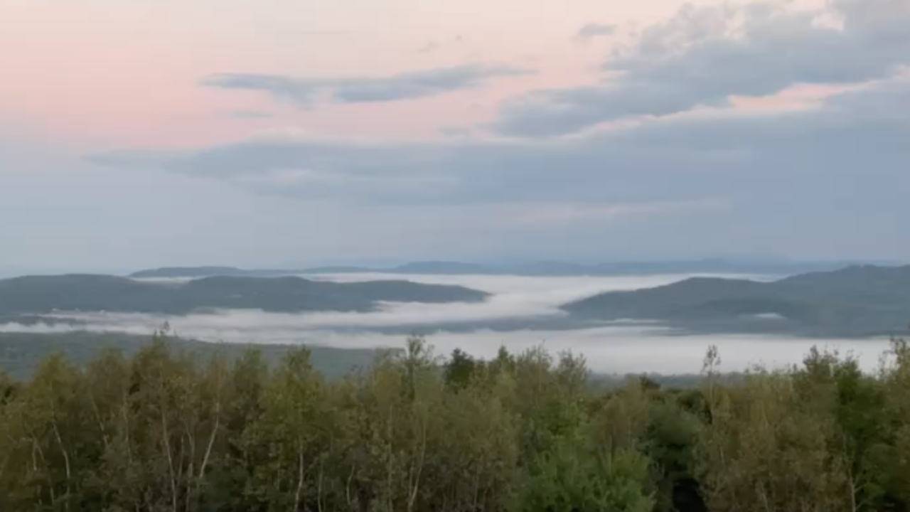 foggy mountain sunrise Maine after a wild night solo travel