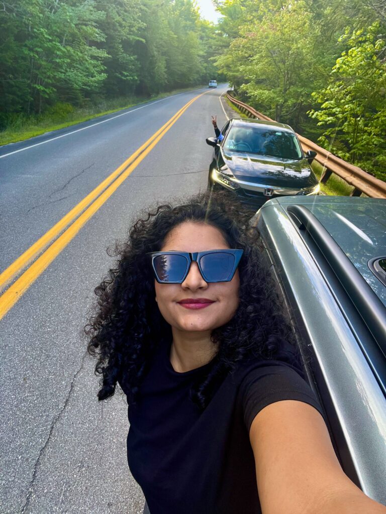 solo traveler on Park Loop Road Acadia National Park Maine dense forest