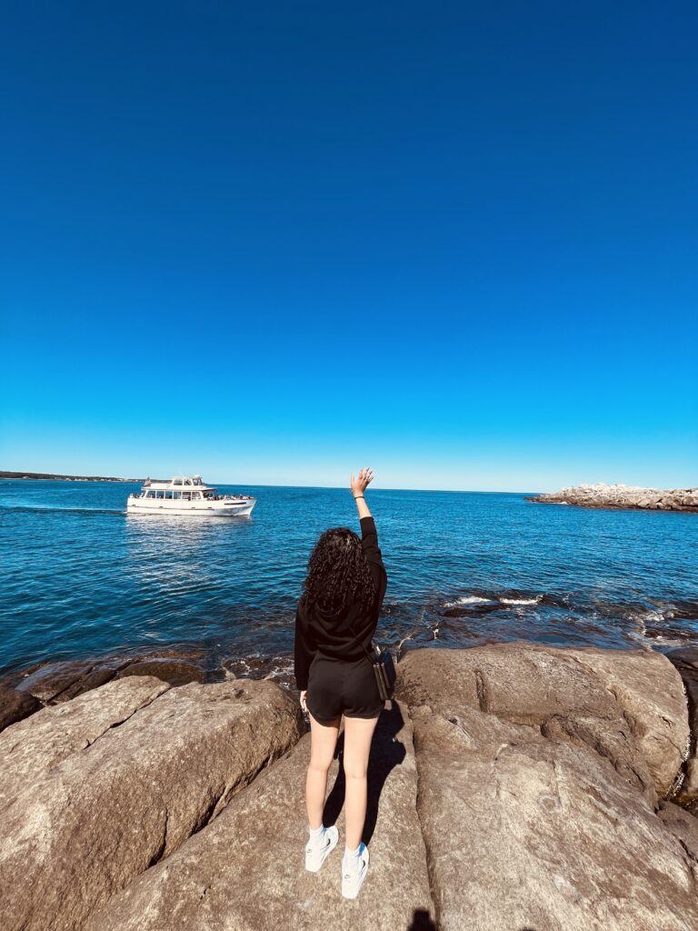 solo traveler at Sohier Park York Maine Nubble Lighthouse